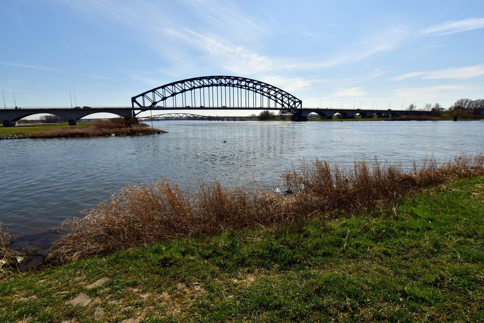 a bridge over a body of water on a sunny day